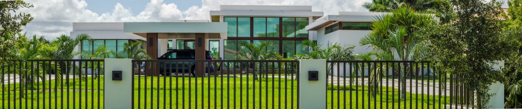 modern and luxurious residence with clean architectural lines, large glass windows, and a sleek white exterior