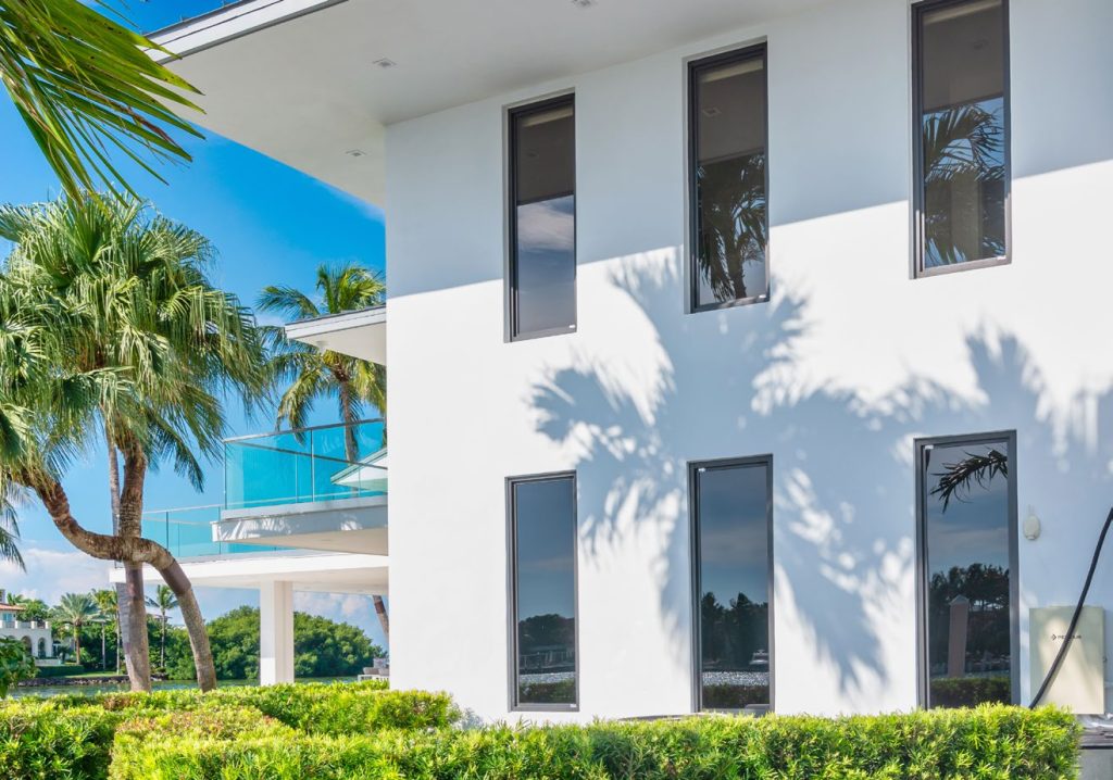 modern white building with large, sleek windows and clean architectural lines