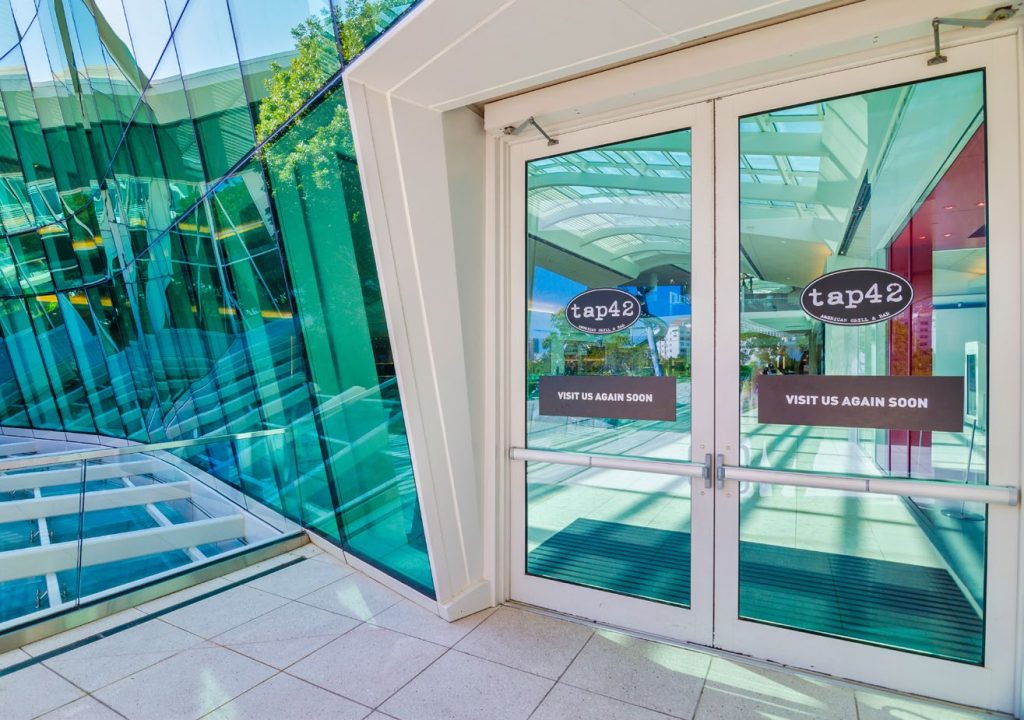 entrance of "Tap42," a modern American grill and bar